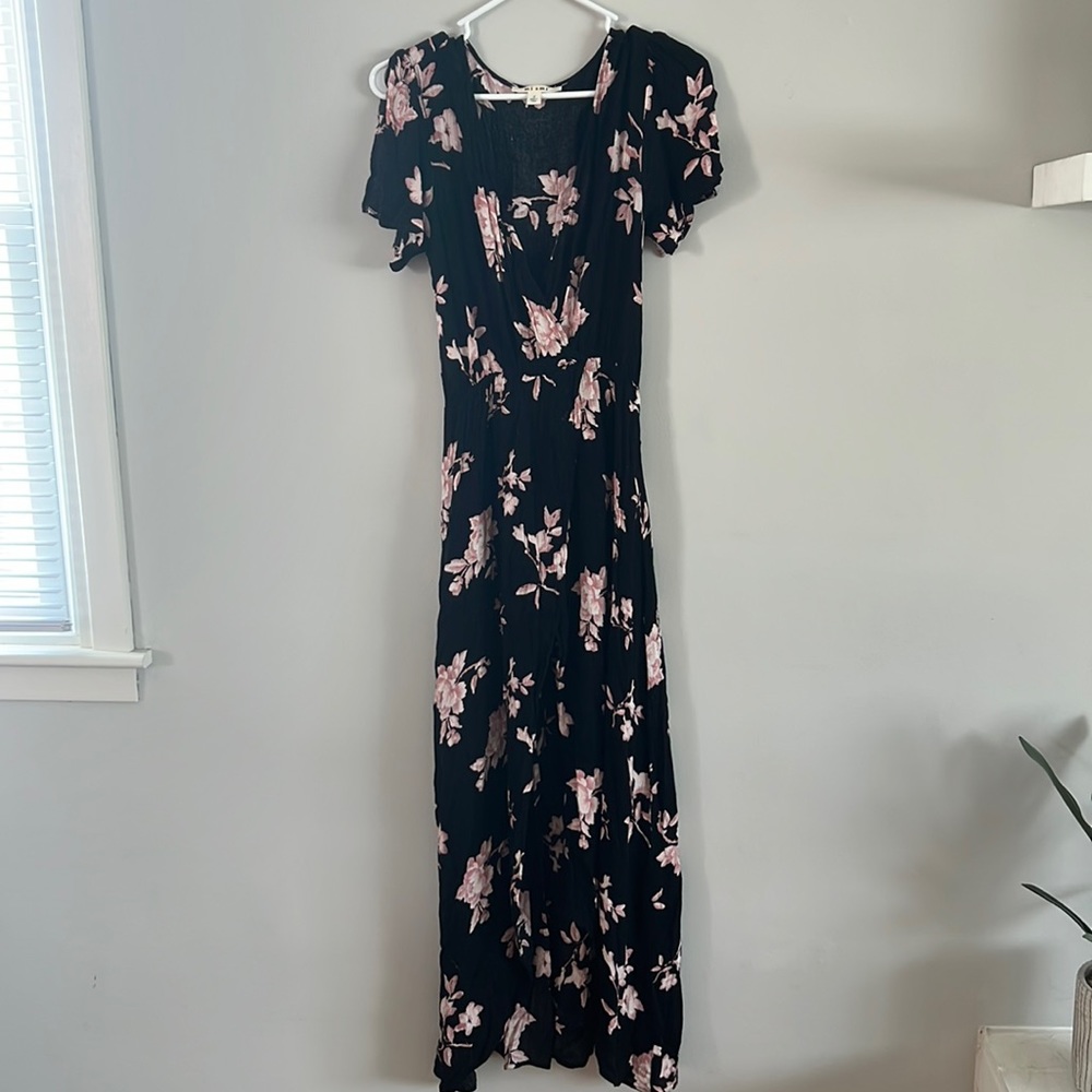 Maxi dress. Long in back, short in front. Shorts underneath. Deep V-neck.